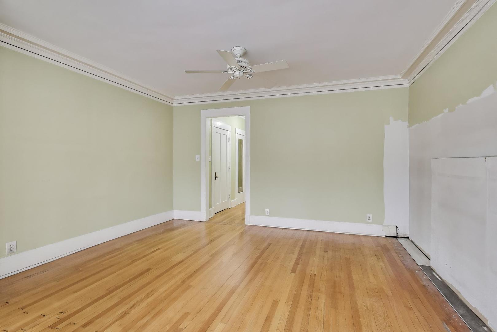 2245 West Giddings Street Chicago, IL 60625 - Photo 5 of 50 a view of an empty room with wooden floor