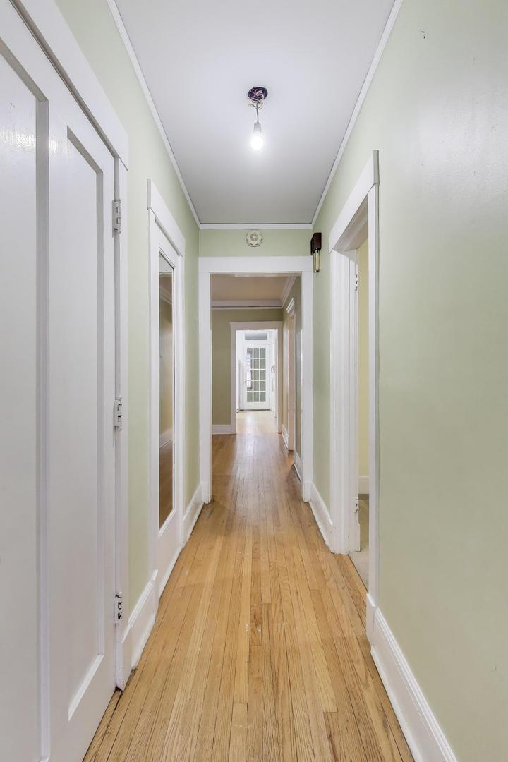 2245 West Giddings Street Chicago, IL 60625 - Photo 6 of 50 a view of a hallway with wooden floor