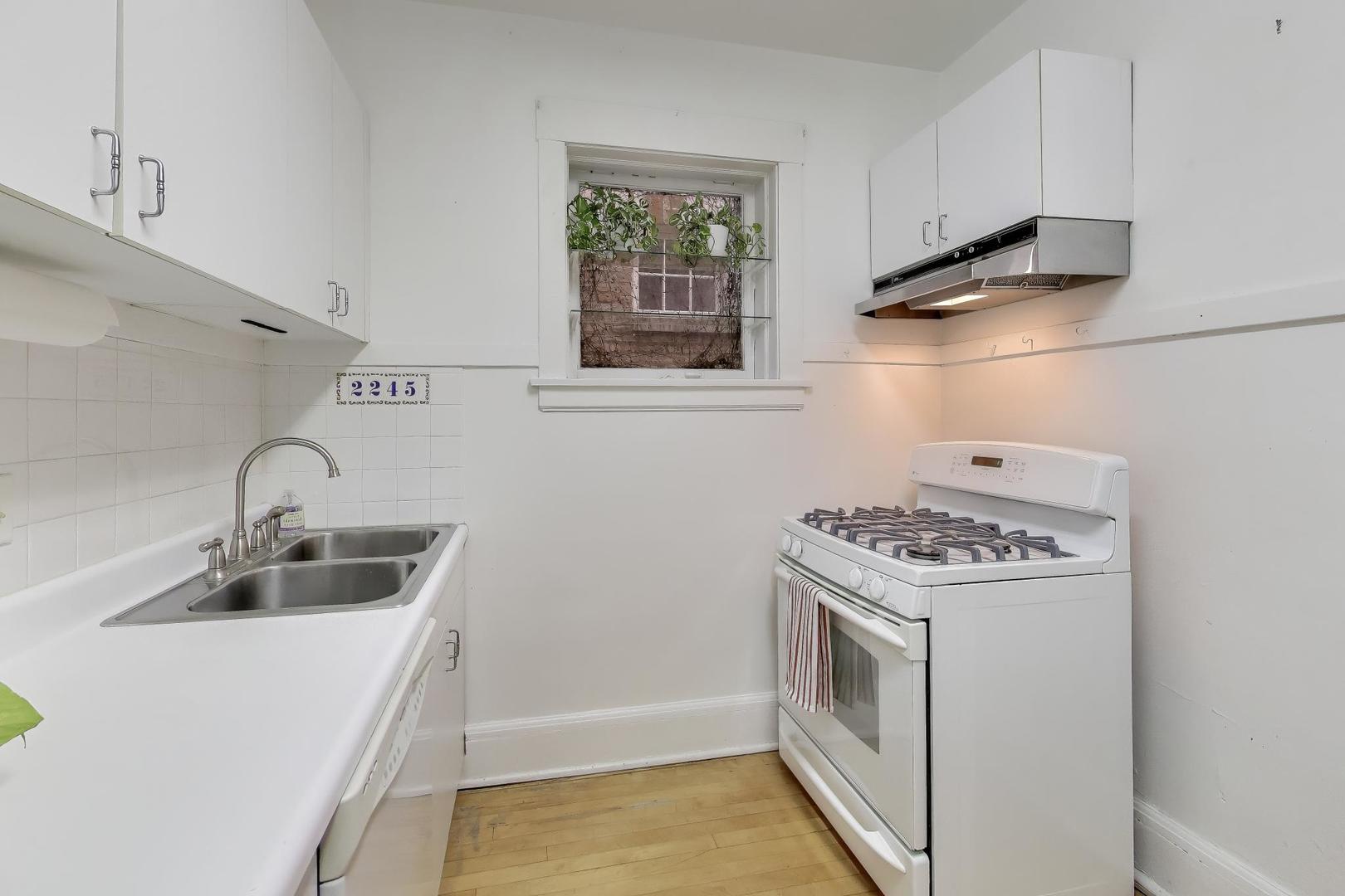 2245 West Giddings Street Chicago, IL 60625 - Photo 9 of 50 a kitchen with a stove and a sink