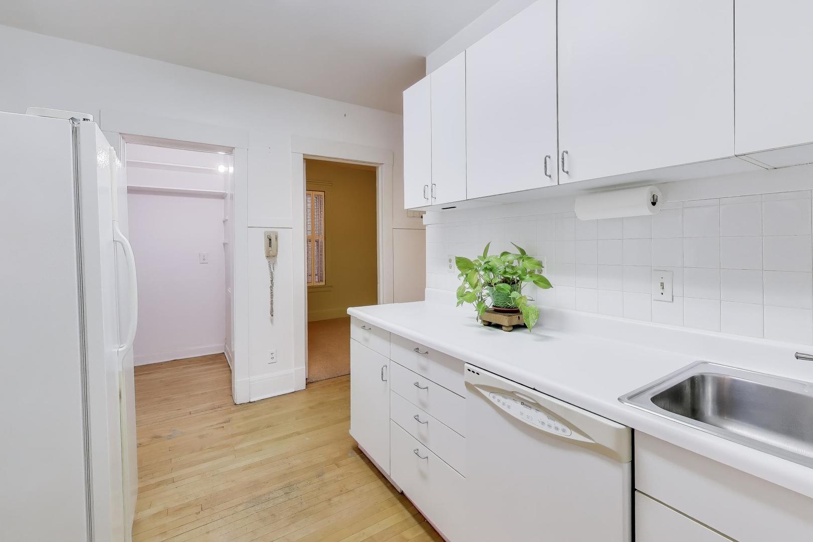 2245 West Giddings Street Chicago, IL 60625 - Photo 10 of 50 a kitchen with a sink and cabinets