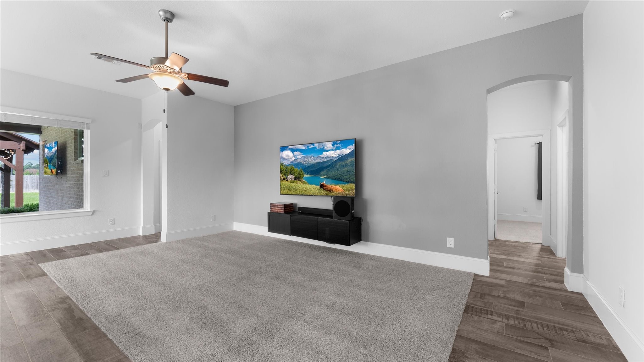 32001 Birch Briar Court Spring, TX 77386 - Photo 19 of 48 Expansive open-concept living room with soaring ceilings, luxury flooring, and effortless flow to the kitchen and dining areas.