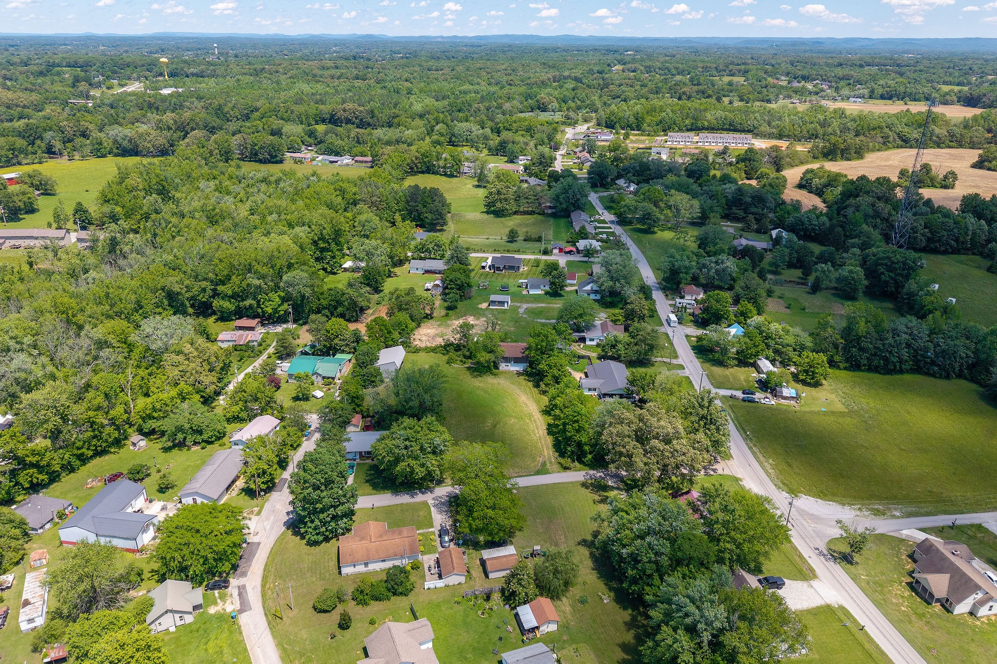 214 5th Avenue South Baxter, TN 38544 - Photo 12 of 20 an aerial view of residential houses with outdoor space and river