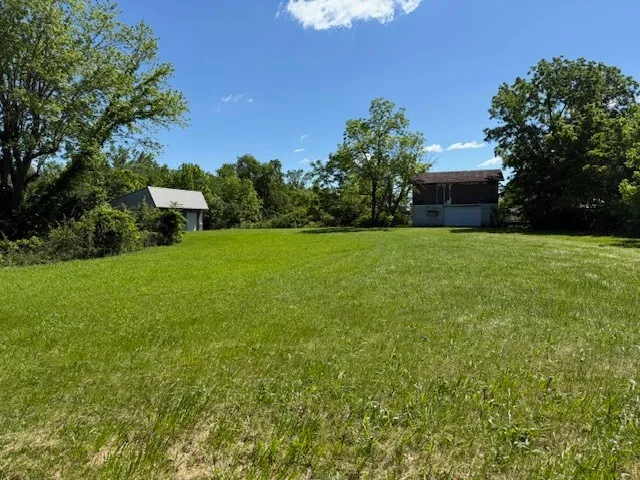 a view of a garden with a house
