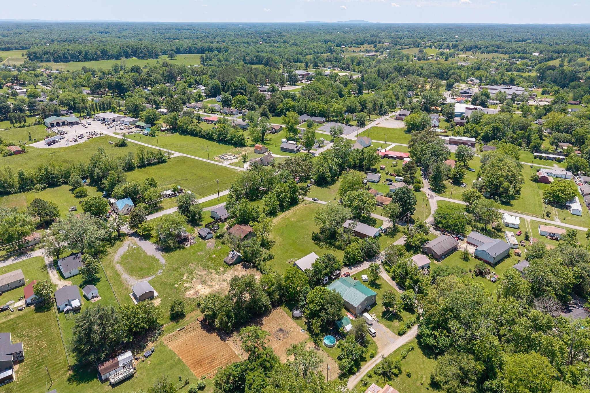 214 5th Avenue South Baxter, TN 38544 - Photo 8 of 20 an aerial view of residential houses with outdoor space and trees