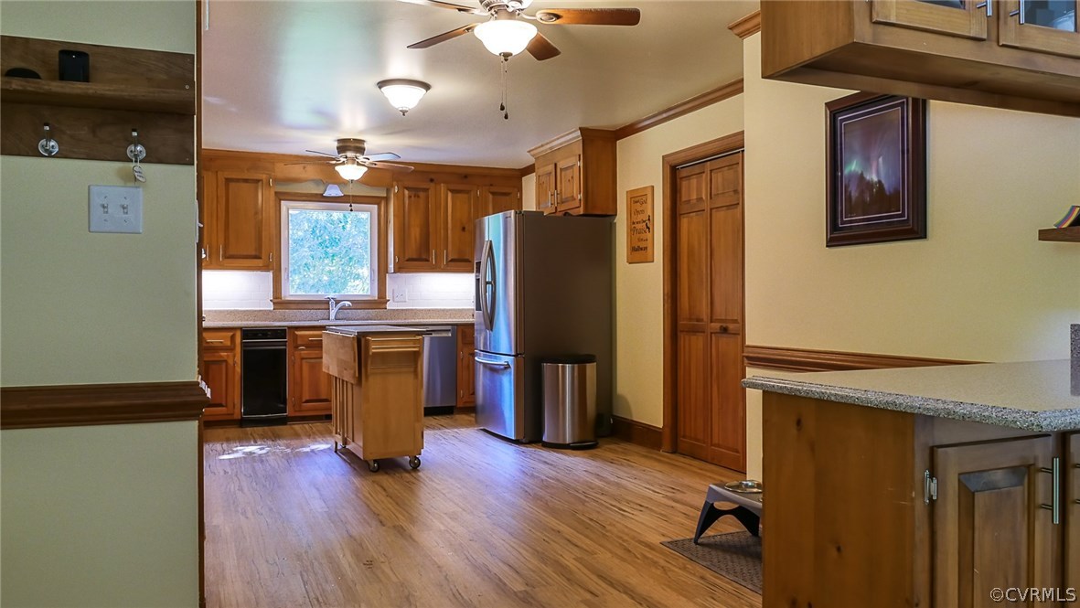 13000 River Road Chesterfield, VA 23838 - Photo 15 of 50 a kitchen with stainless steel appliances granite countertop a refrigerator a stove and a wooden floors