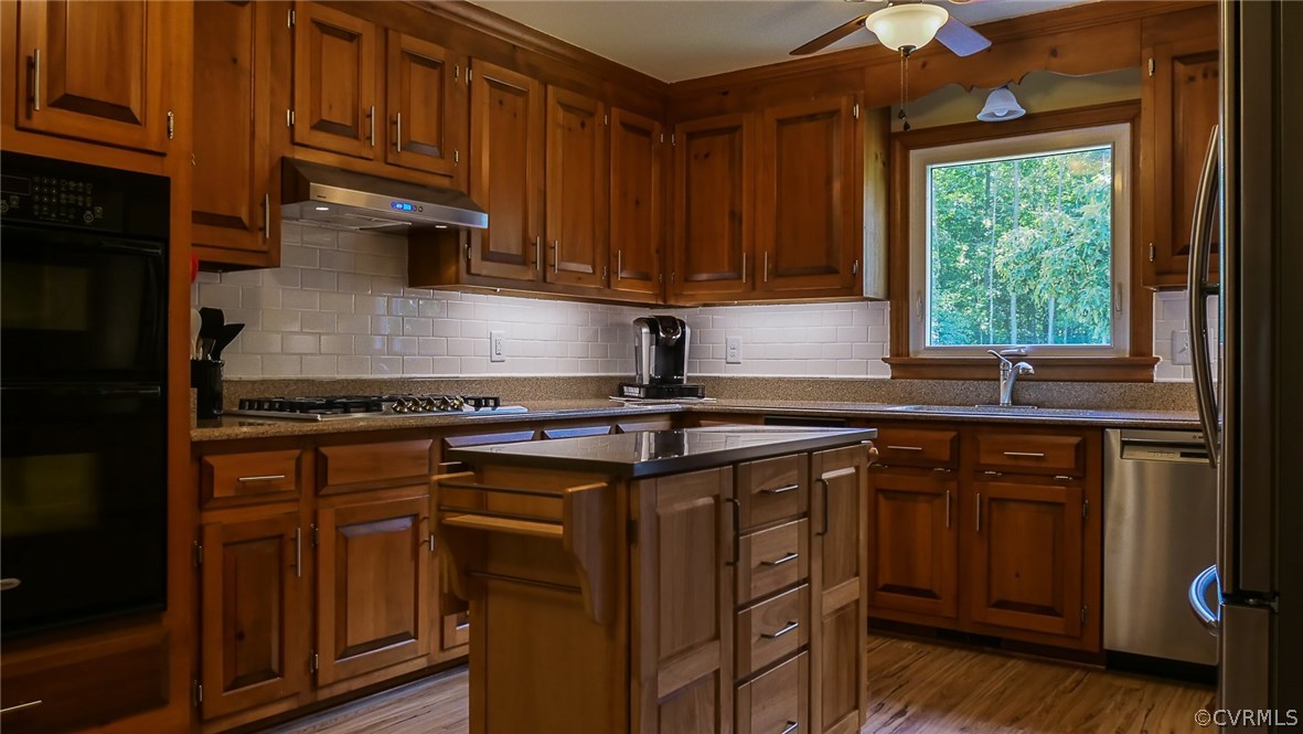 13000 River Road Chesterfield, VA 23838 - Photo 17 of 50 a kitchen with stainless steel appliances granite countertop a sink stove and cabinets