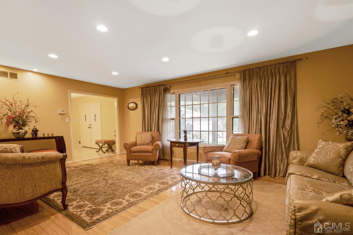 6 Fox Hill Road Edison, NJ 08820 - Photo 5 of 26 a living room with furniture and a large window