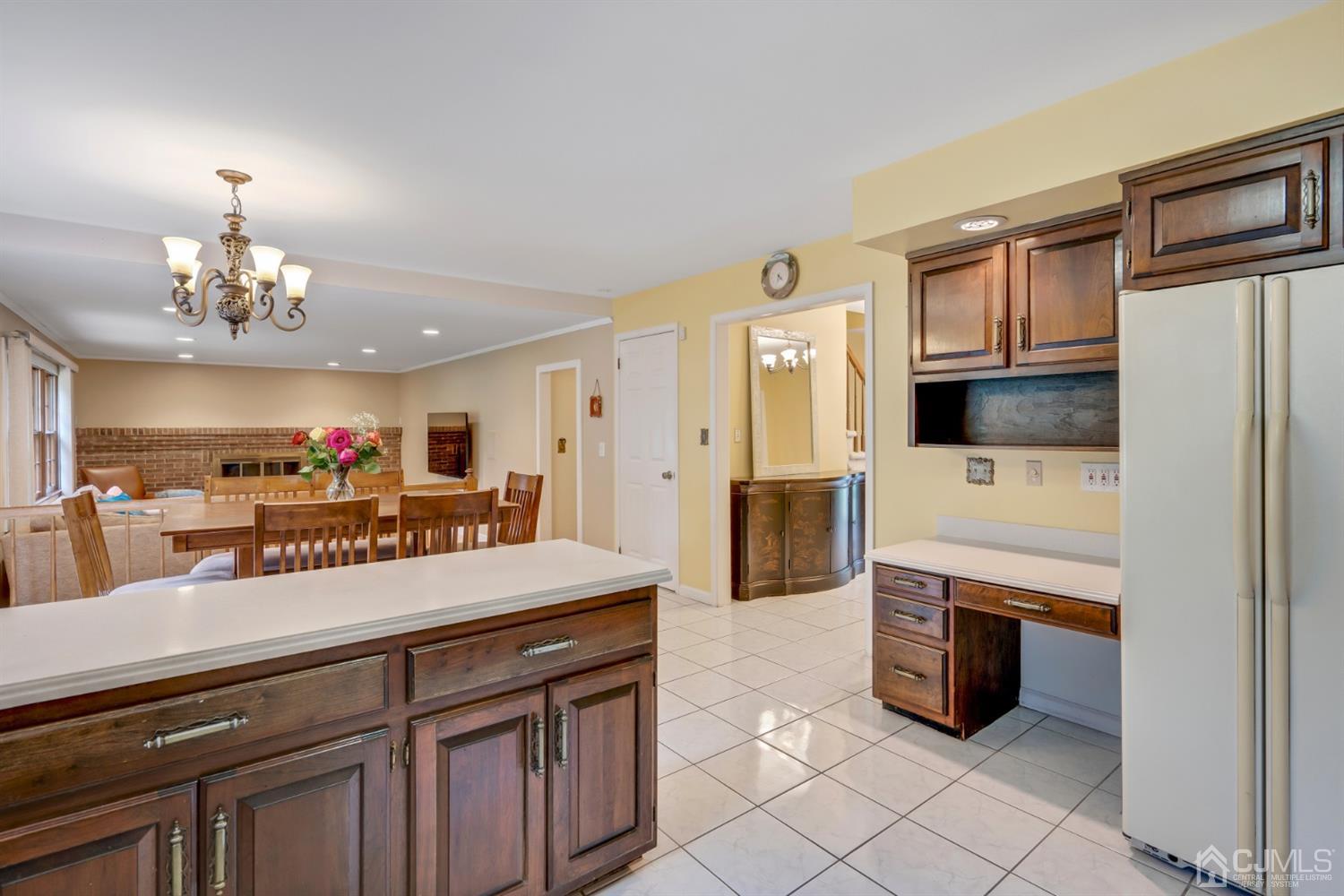 6 Fox Hill Road Edison, NJ 08820 - Photo 7 of 26 a spacious kitchen with stainless steel appliances a sink and a refrigerator