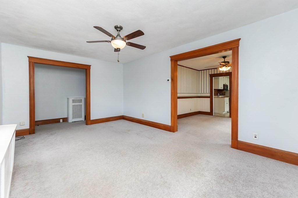 45 Redlands Road Boston, MA 02132 - Photo 12 of 41 a view of a livingroom with a ceiling fan and window