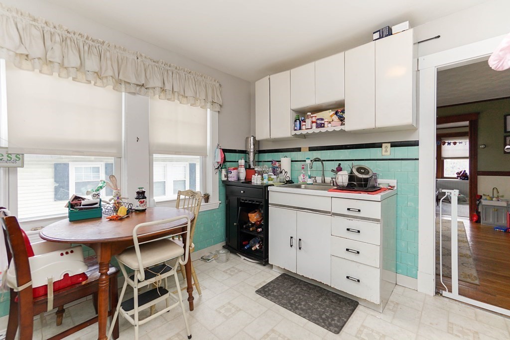 45 Redlands Road Boston, MA 02132 - Photo 20 of 41 a kitchen with a table and chairs in it