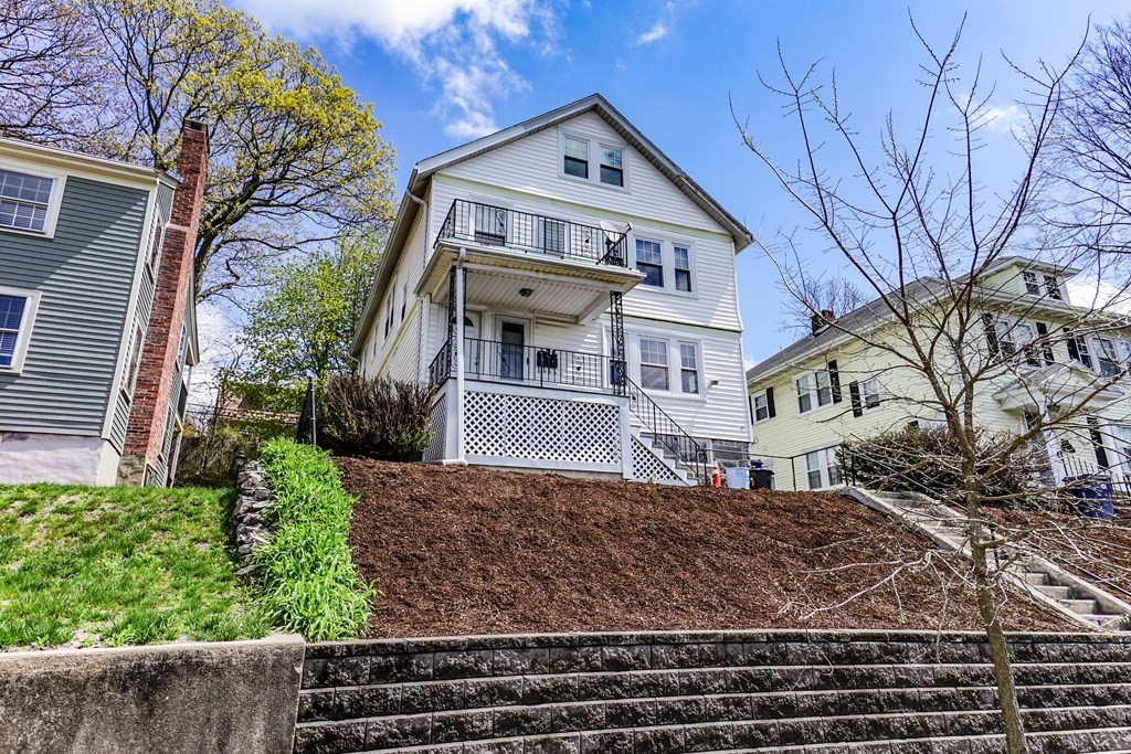 45 Redlands Road Boston, MA 02132 - Photo 2 of 41 a front view of a house with garden