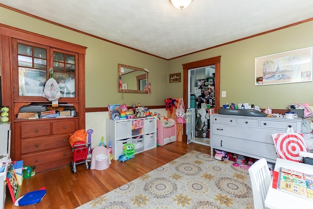 45 Redlands Road Boston, MA 02132 - Photo 21 of 41 a bed room with a bed and wooden floor