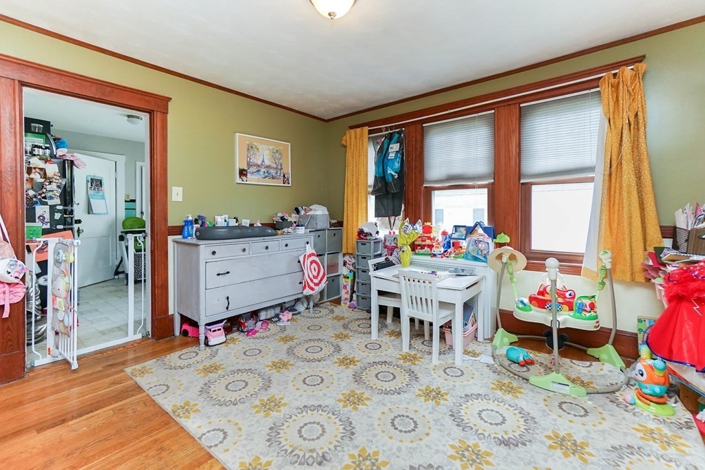 45 Redlands Road Boston, MA 02132 - Photo 22 of 41 a living room with furniture and a large window