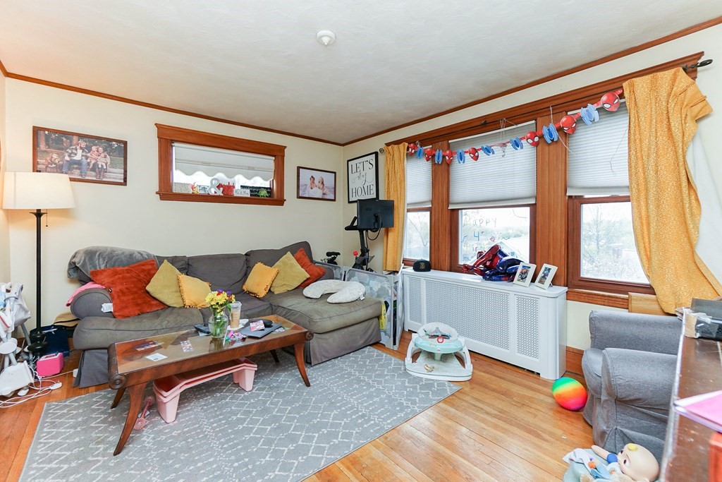 45 Redlands Road Boston, MA 02132 - Photo 25 of 41 a living room with furniture and a window