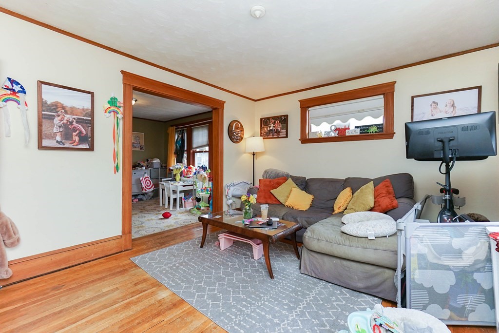 45 Redlands Road Boston, MA 02132 - Photo 26 of 41 a living room with furniture and wooden floor