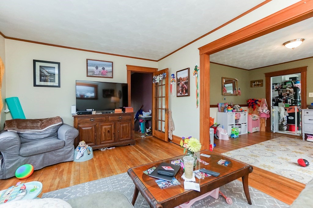 45 Redlands Road Boston, MA 02132 - Photo 27 of 41 a living room with furniture and a flat screen tv