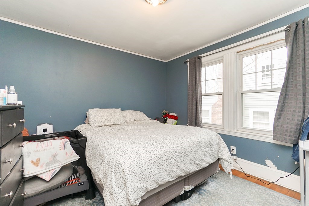 45 Redlands Road Boston, MA 02132 - Photo 29 of 41 a bedroom with a bed and a window