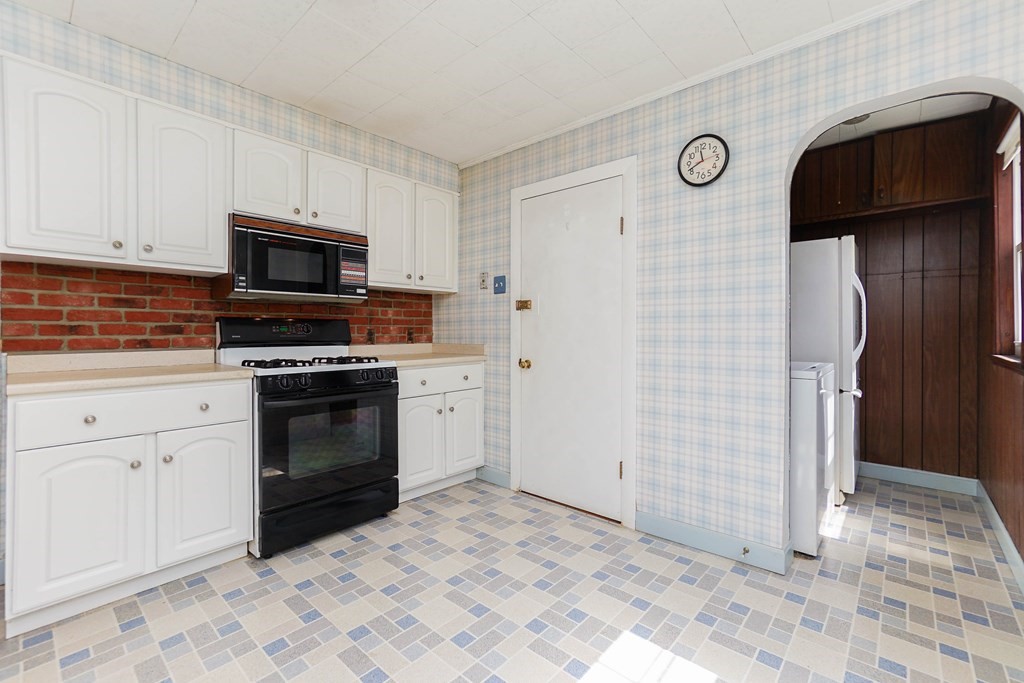 45 Redlands Road Boston, MA 02132 - Photo 4 of 41 a kitchen with granite countertop cabinets and steel stainless steel appliances