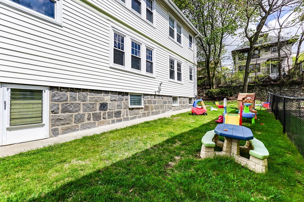 45 Redlands Road Boston, MA 02132 - Photo 41 of 41 a room with furniture and a gate