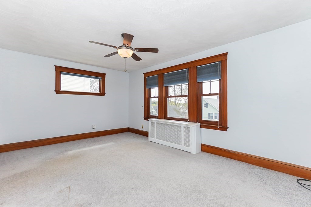 45 Redlands Road Boston, MA 02132 - Photo 10 of 41 a view of an empty room with a window