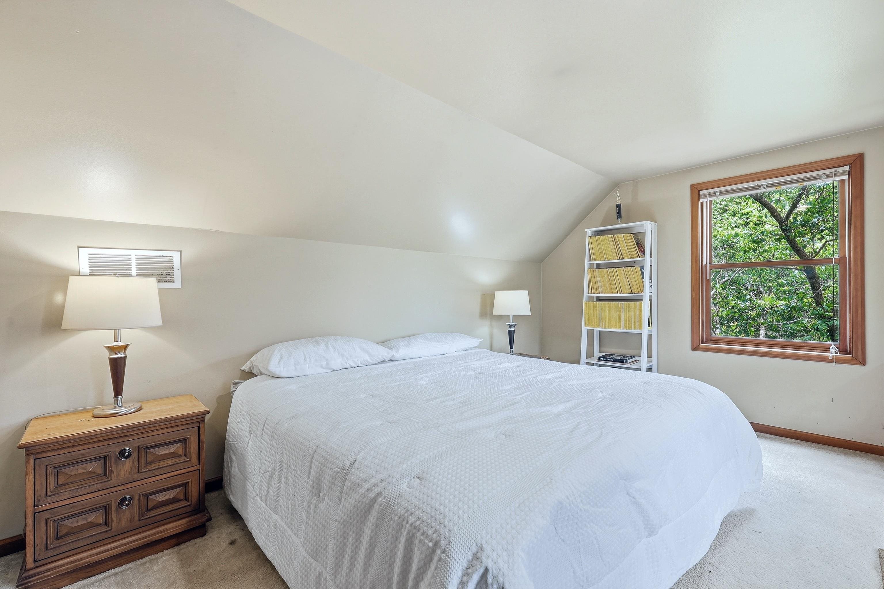13 Signal Point Lane Galena, IL 61036 - Photo 28 of 47 a bedroom with a bed and a window