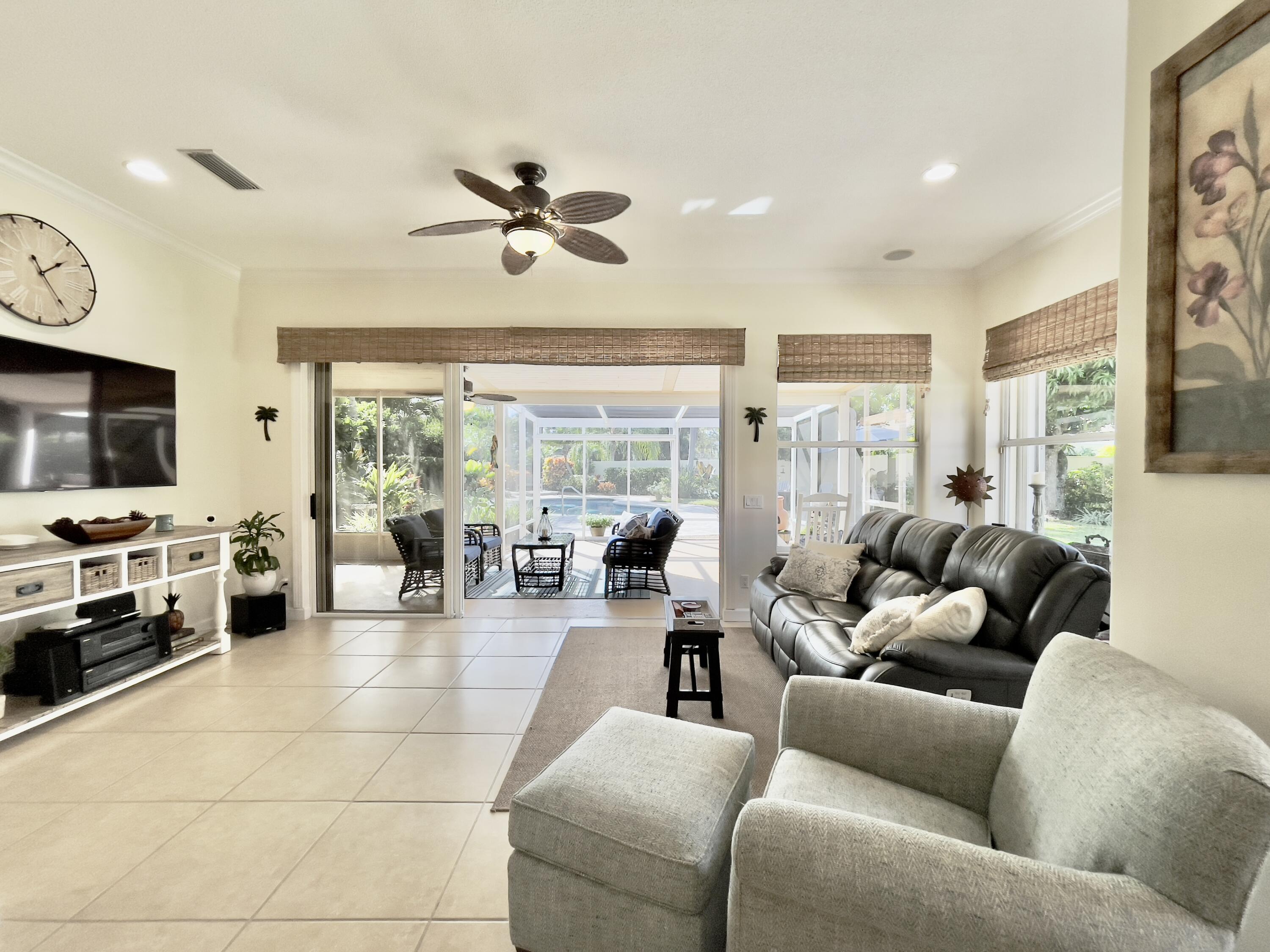174 Hampton Circle Jupiter, FL 33458 - Photo 15 of 45 a living room with furniture and a flat screen tv