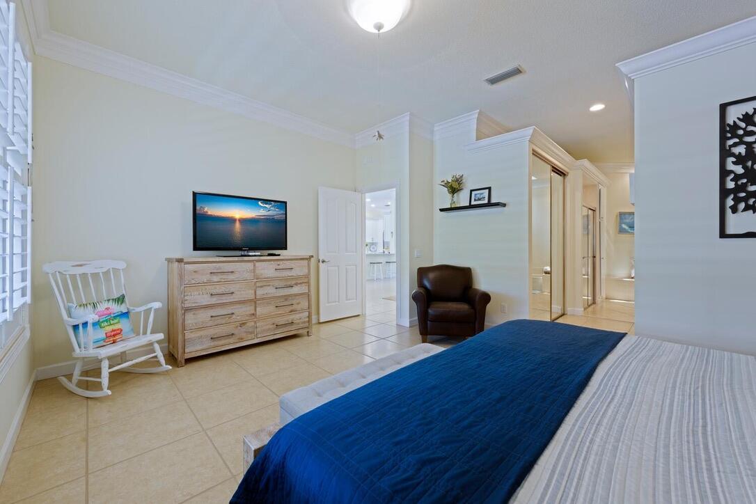 174 Hampton Circle Jupiter, FL 33458 - Photo 18 of 45 a living room with furniture and a flat screen tv