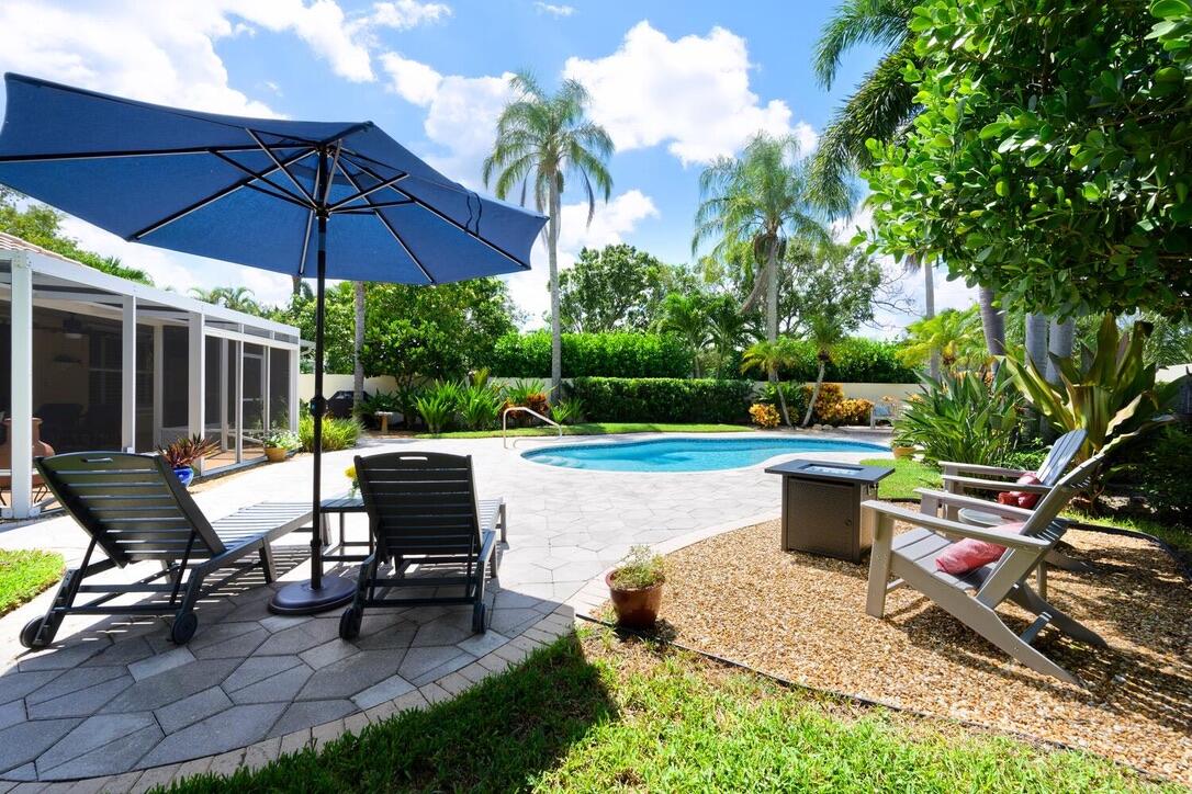 174 Hampton Circle Jupiter, FL 33458 - Photo 2 of 45 a view of a backyard with sitting area and furniture