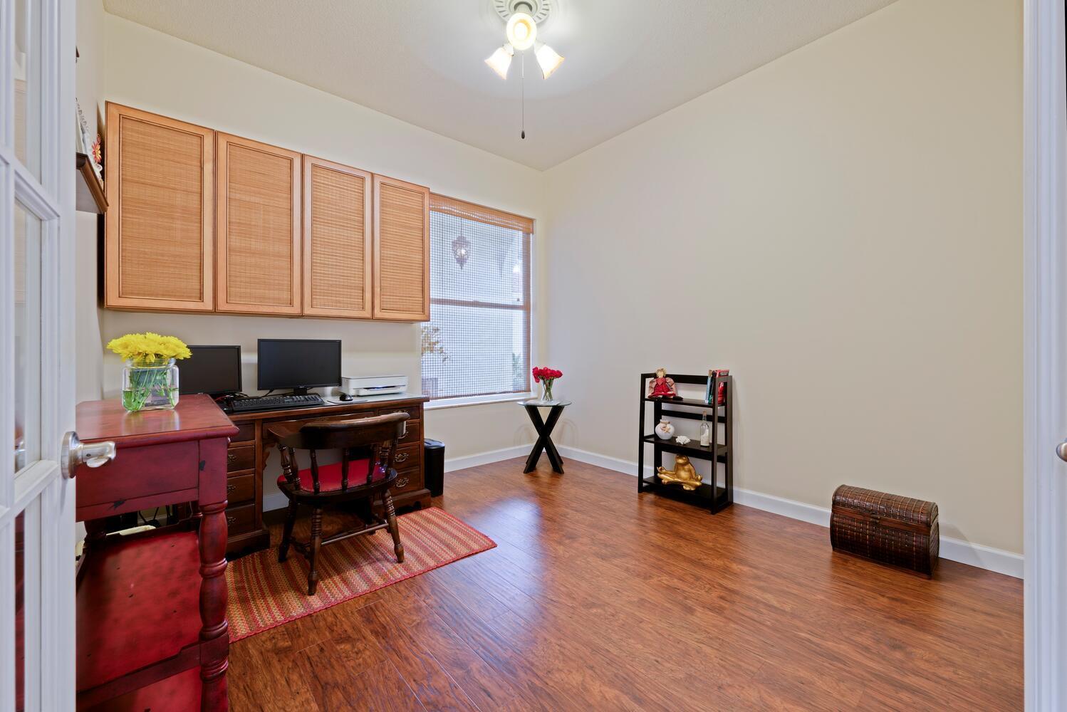 174 Hampton Circle Jupiter, FL 33458 - Photo 22 of 45 a living room with furniture and a wooden floor