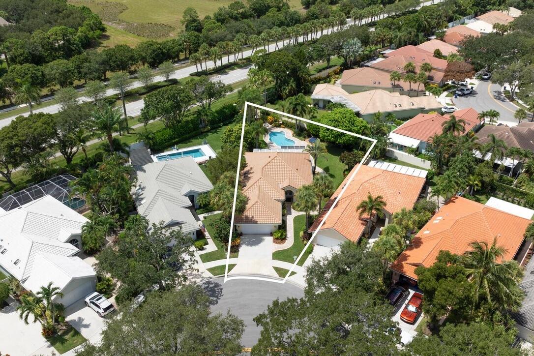 174 Hampton Circle Jupiter, FL 33458 - Photo 3 of 45 an aerial view of multiple houses with yard
