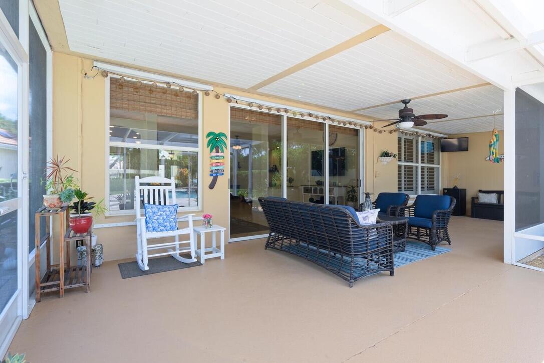 174 Hampton Circle Jupiter, FL 33458 - Photo 31 of 45 a living room with furniture and a window