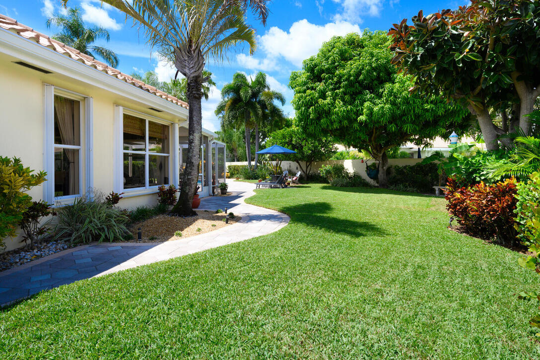 174 Hampton Circle Jupiter, FL 33458 - Photo 39 of 45 a view of a house with backyard and garden