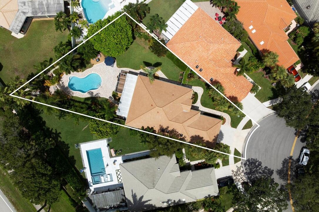 174 Hampton Circle Jupiter, FL 33458 - Photo 41 of 45 an aerial view of a house with a yard