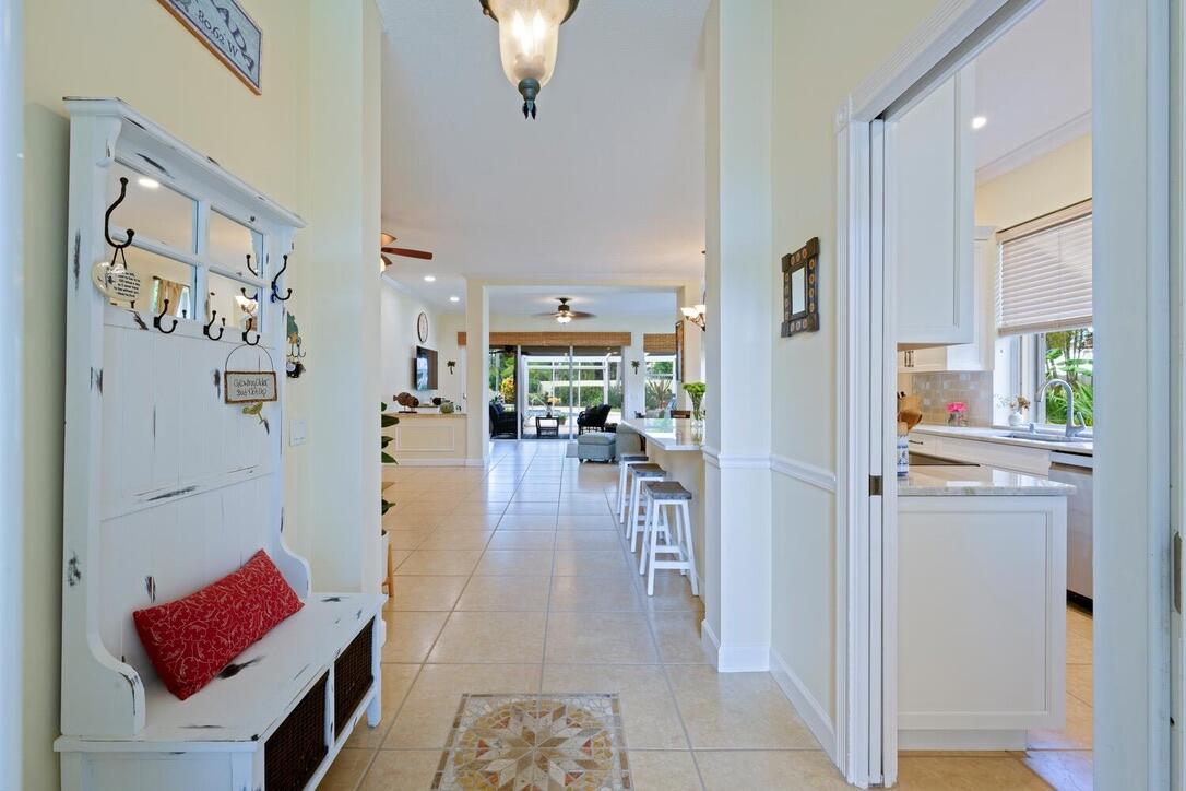 174 Hampton Circle Jupiter, FL 33458 - Photo 6 of 45 a living room with furniture and a large window