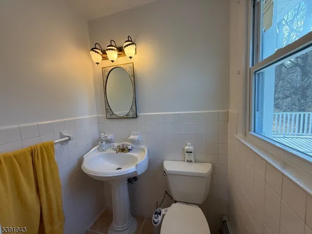 a view of a entryway door with wooden floor