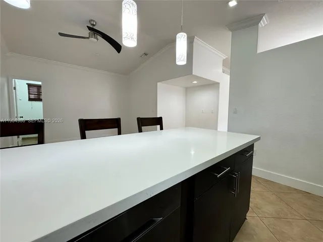 a large bathroom with a sink and a mirror
