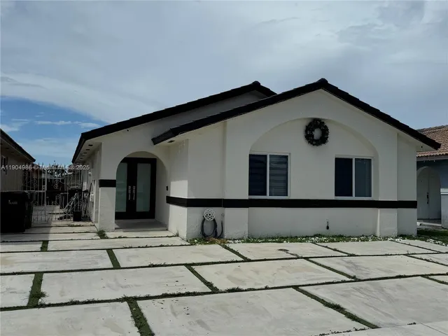 a house view with a outdoor space