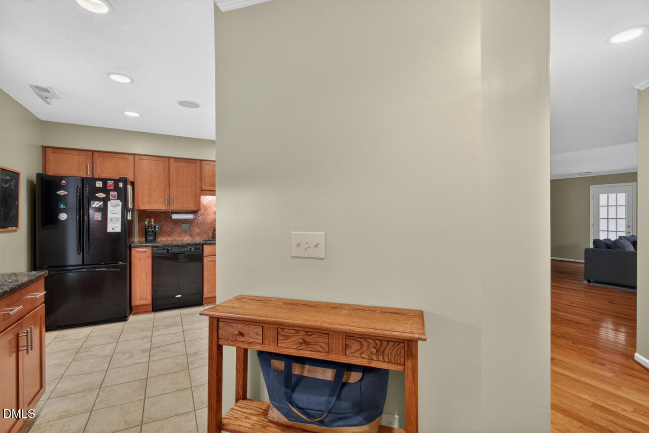 3307 Coachman's Way Durham, NC 27705 - Photo 4 of 50 a kitchen with stainless steel appliances a refrigerator and a stove top oven