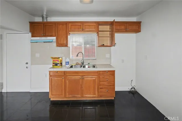 a bathroom with a sink a mirror and shower