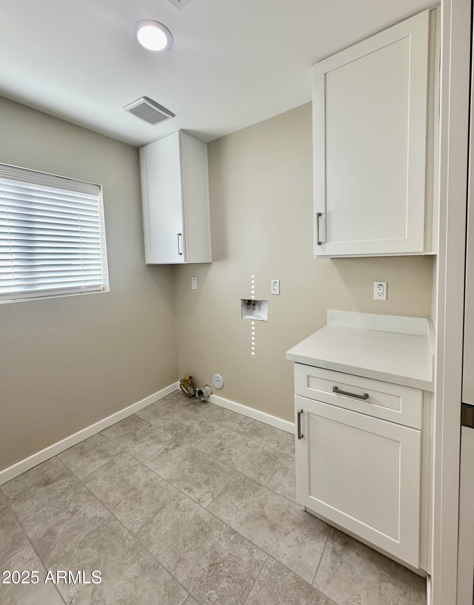 2329 East Enrose Street Mesa, AZ 85213 - Photo 11 of 30 a view of a storage & utility room in a house