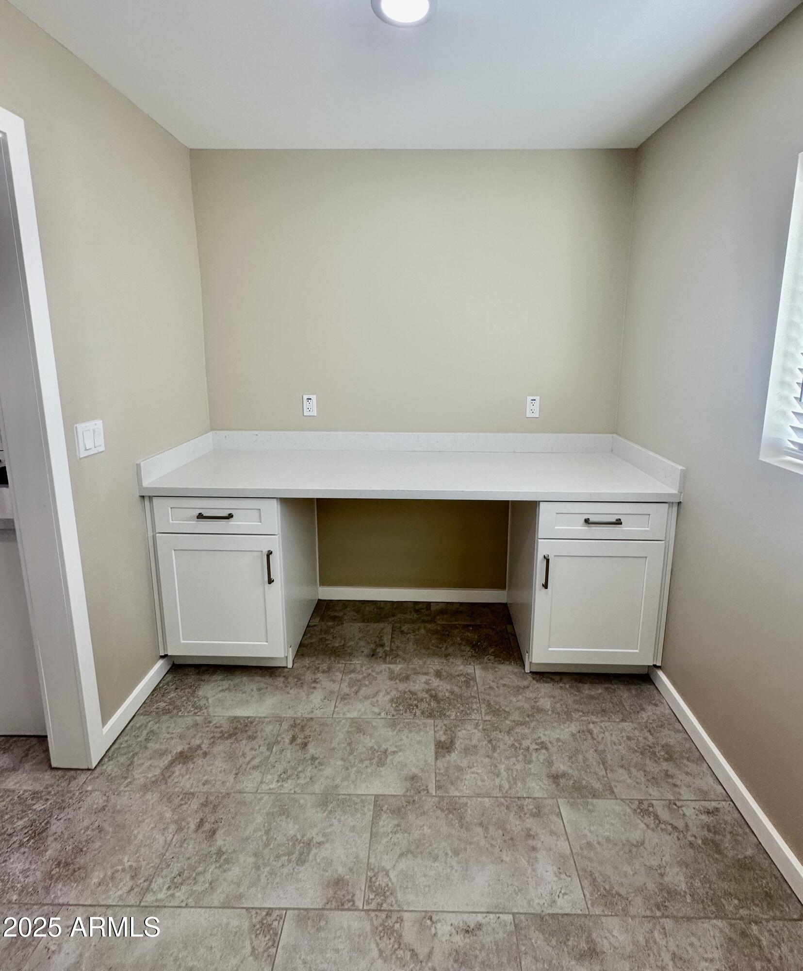 2329 East Enrose Street Mesa, AZ 85213 - Photo 12 of 30 a room with a sink and cabinets