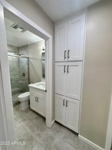 a bathroom with a bathtub and a toilet