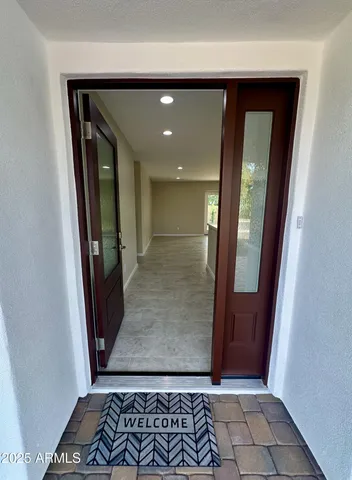 an entryway with a rug
