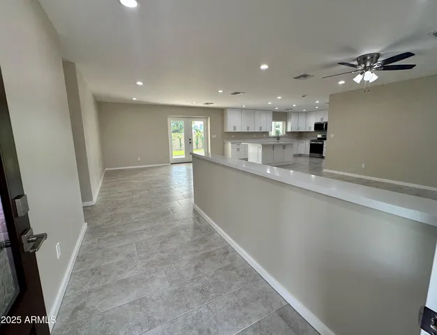 a view of a kitchen and windows