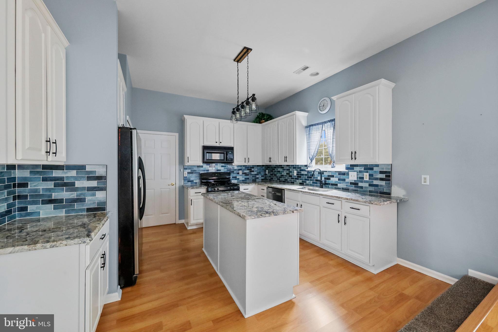 19 Pear Tree Place Sewell, NJ 08080 - Photo 13 of 47 a kitchen with white cabinets and stainless steel appliances