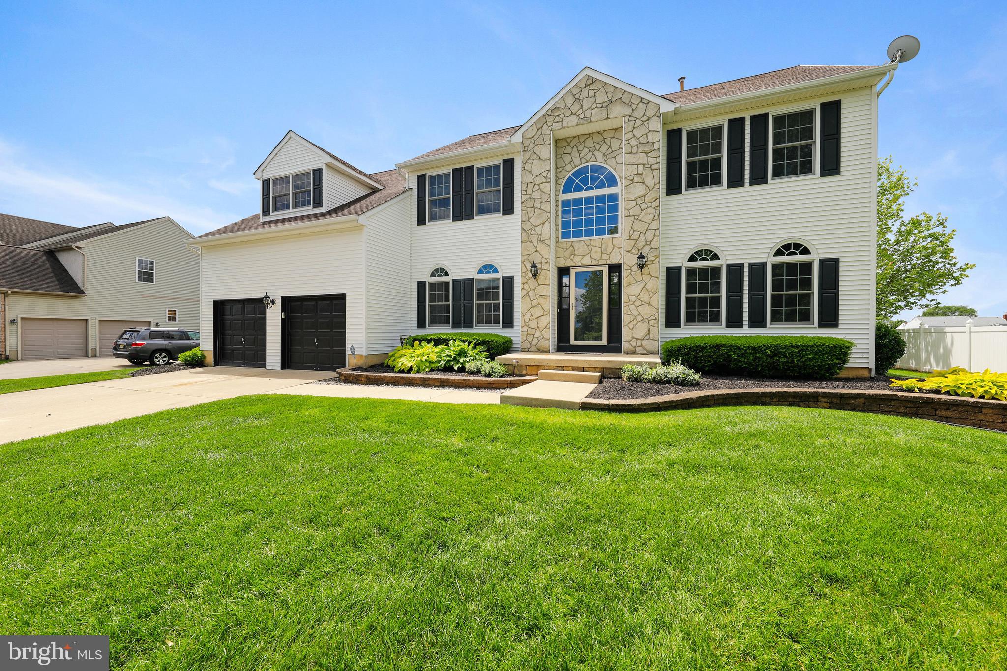 19 Pear Tree Place Sewell, NJ 08080 - Photo 2 of 47 a front view of a house with swimming pool and fire pit