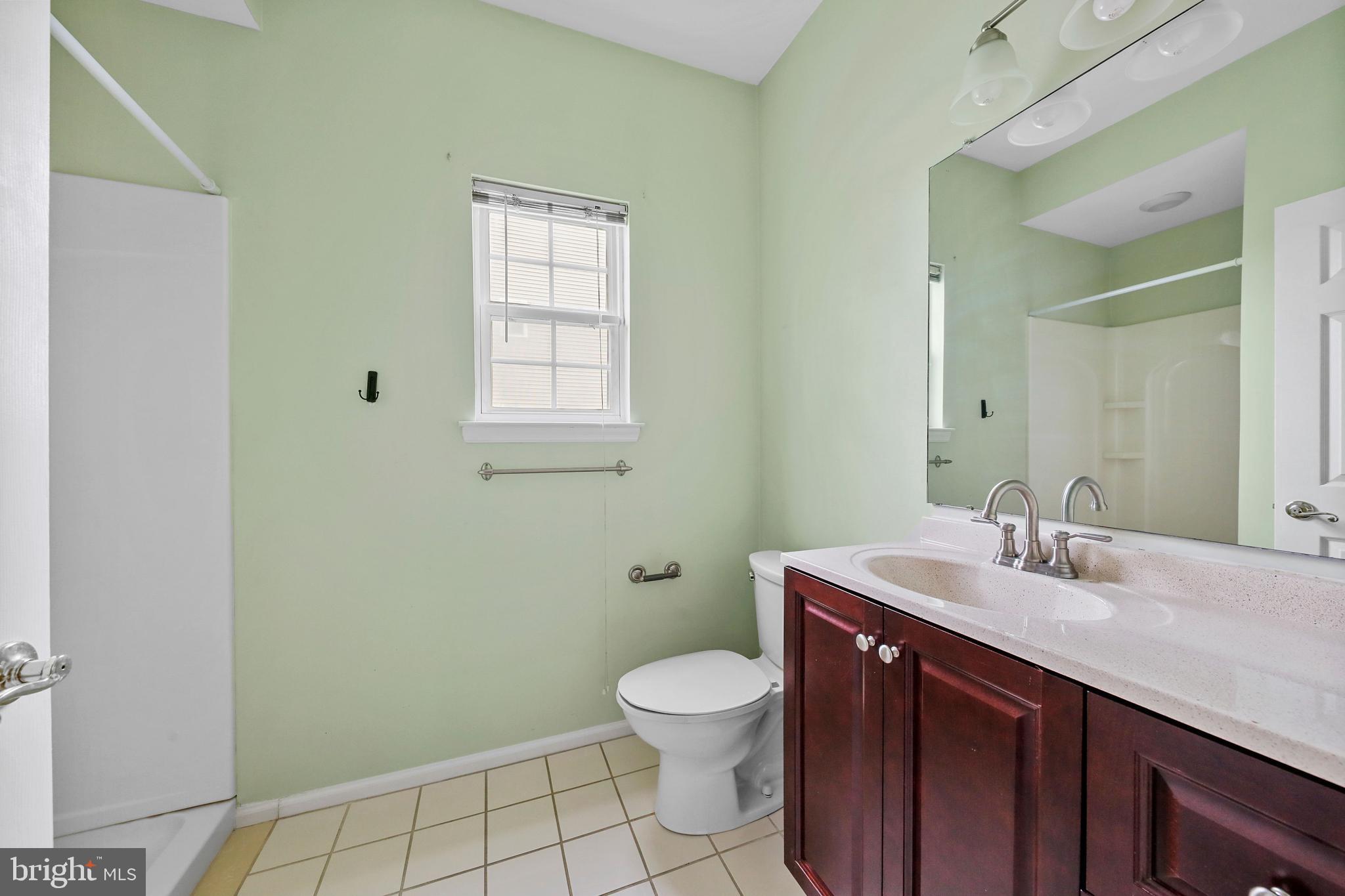 19 Pear Tree Place Sewell, NJ 08080 - Photo 21 of 47 a bathroom with a sink a toilet and a mirror