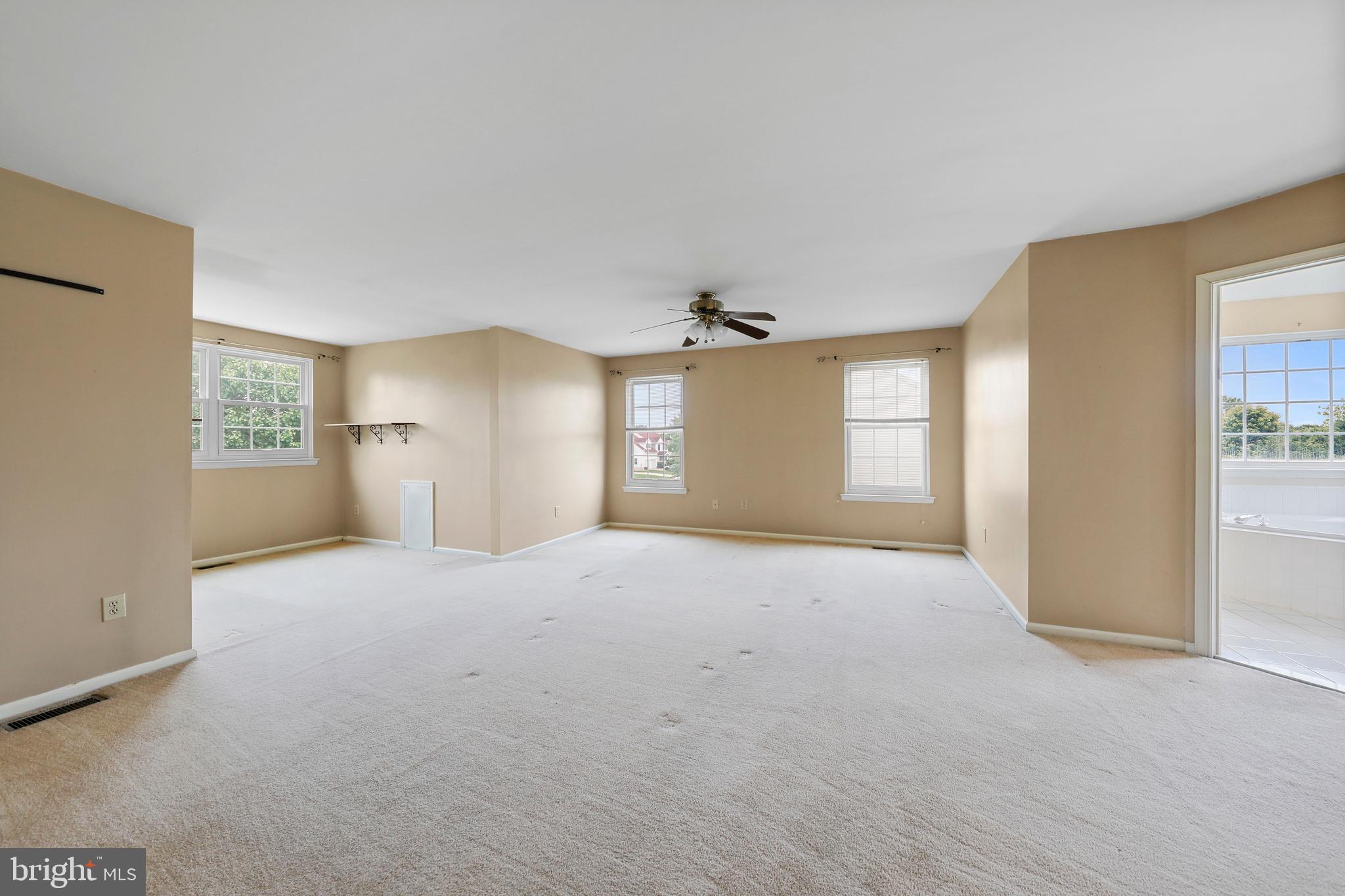19 Pear Tree Place Sewell, NJ 08080 - Photo 24 of 47 a view of empty room with windows and refrigerator