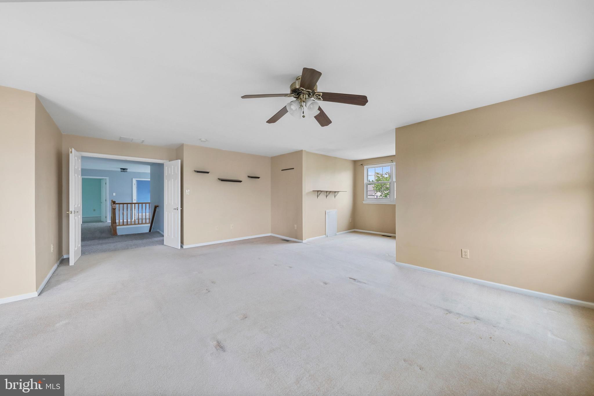19 Pear Tree Place Sewell, NJ 08080 - Photo 26 of 47 a view of a big room with chandelier fan and windows