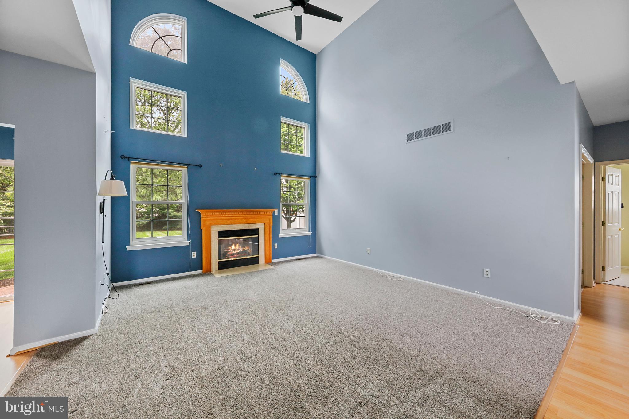 19 Pear Tree Place Sewell, NJ 08080 - Photo 6 of 47 a view of an empty room with a fireplace and a window